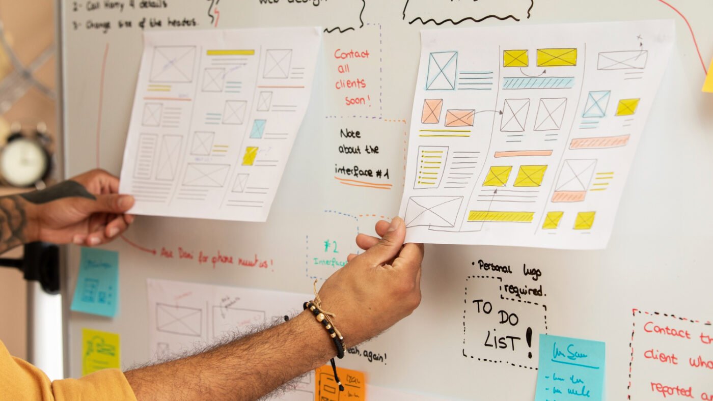 A UX designer planning the app layout 