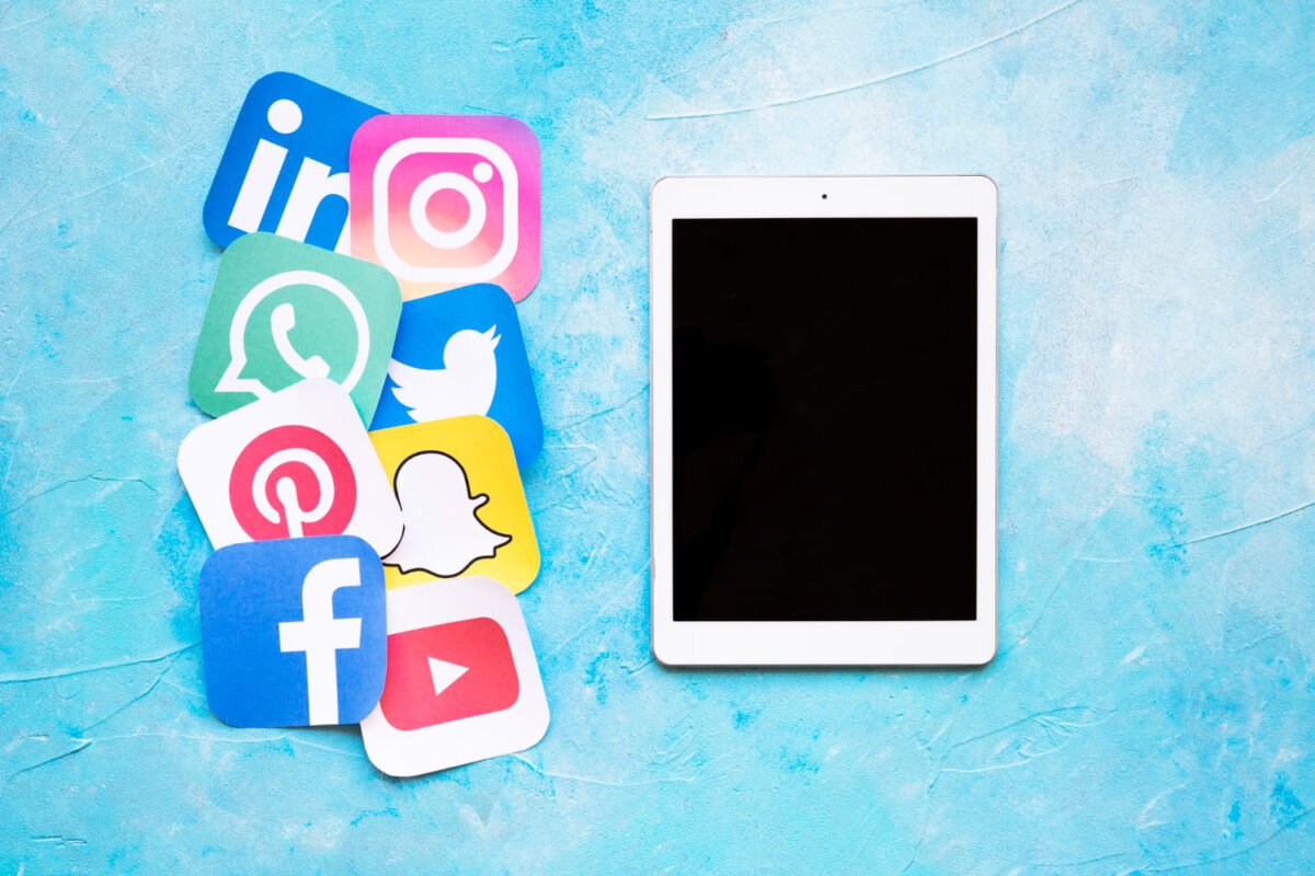 iPad with social media icons promoting Black Friday offers | Source: Freepik